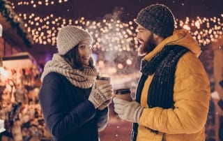 Photo of a Couple Drinking Hot Cocoa During a Wintertime Romantic Getaway in Pennsylvania.