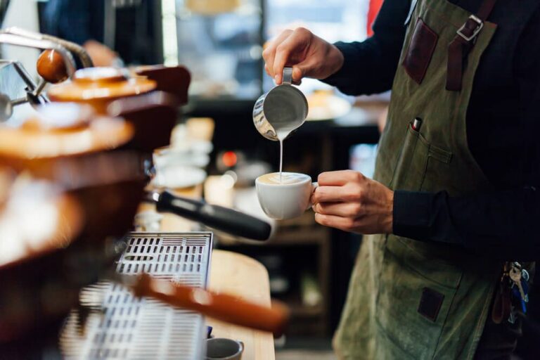 person pouring a drink at the coffee places in Harrisburg PA